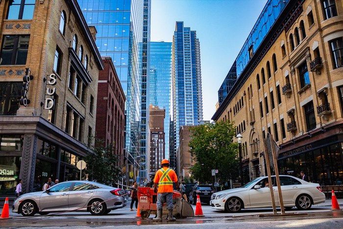 Downtown street scene framed by high-rise architecture
